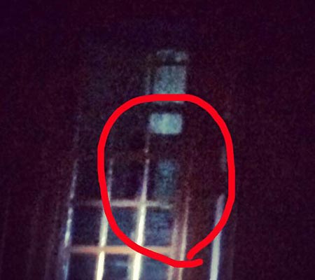 Shape in the window in a building on the Colonial Ghost Tour