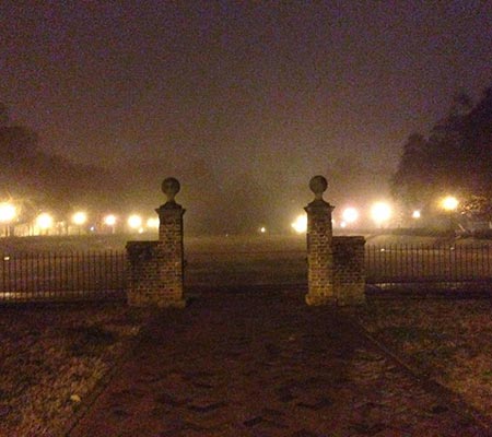 Haunted looking gates at night in Colonial Williamsburg, Virginia