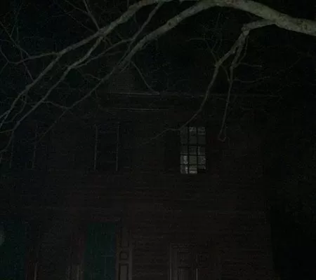 Ghost in the window during a ghost tour