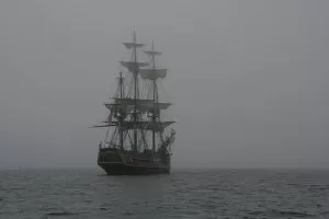 spirits and ghosts: a ghostly ship floats behind a thick fog