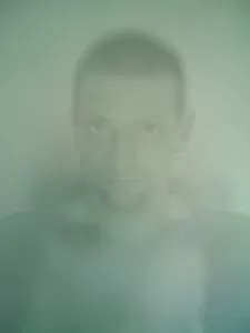 a ghostly man's face underwater