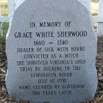 A vertical stone marker with Grace Sherwood information